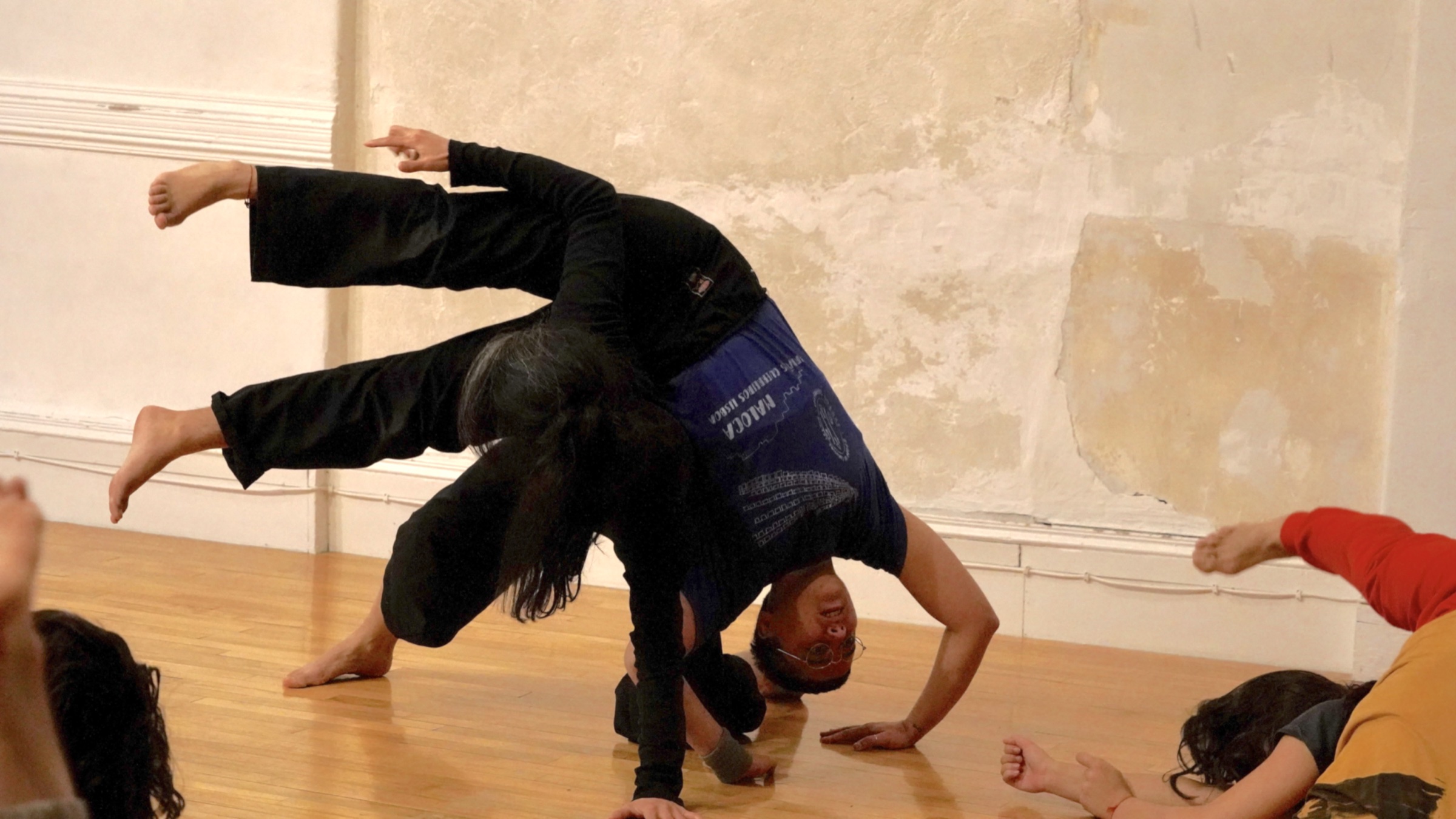 Oliver Artur and a partner exploring shared weight during Contact Improvisation.